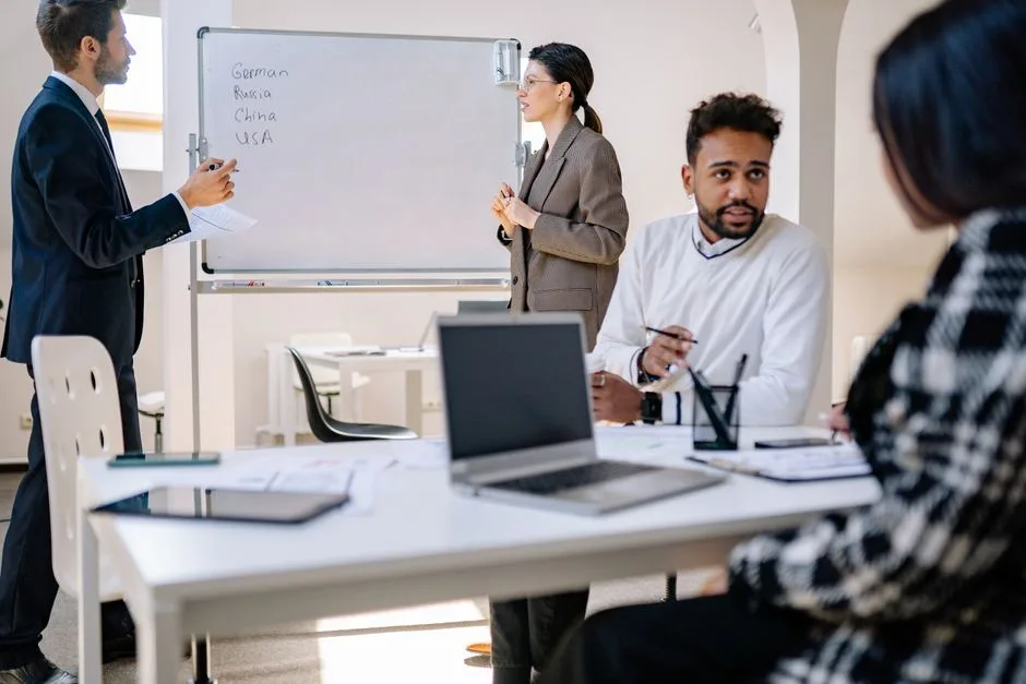 A diverse group of professionals engaged in a collaborative office meeting